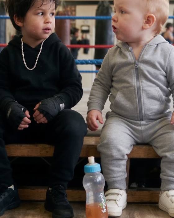 Two boys at a boxing gym, one wearing a CRAFTD chain